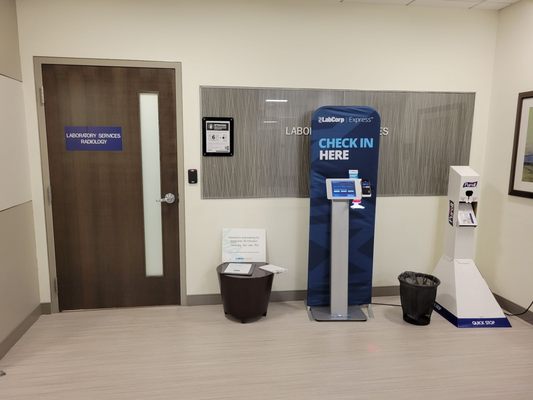 Check in kiosk. Someone will come out to get you after you check in.