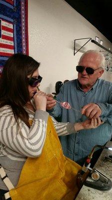 Blowing glass for a Christmas ornament