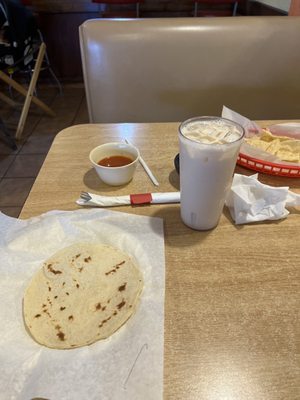 Tortilla with butter and Agua de Horchata.