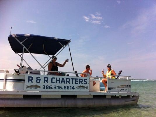 Friends having fun at the famous "Disappearing Island" in Ponce Inlet, FL