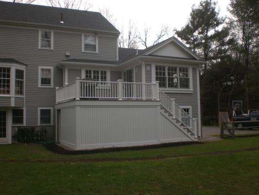 Deck was completely redone with Azek decking materials, a kitchen bump out was added and to the right an eating area addition!