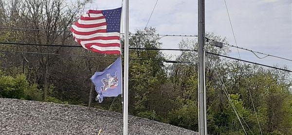 Pathetic flag display.  Both flags are tattered and torn. Sad that this goes unchecked. Notified management.