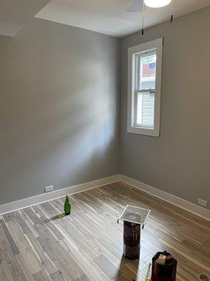 Floor,trim,baseboard, and new drywall in bedroom