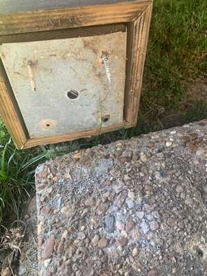 Four masonry screws were the only thing holding this post to the concrete slab.