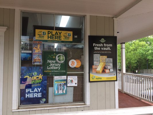 Lots of lottery posters in front window and wall