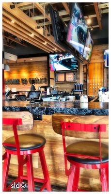 Bar seating is available with multiple large screen TVs.