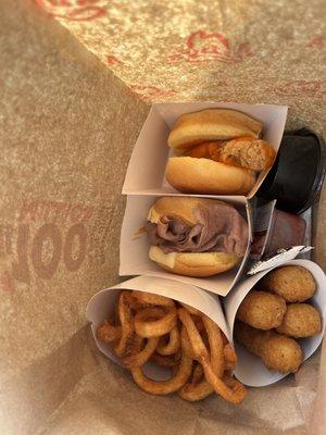 Buffalo chicken slider, jalapeño roast beef slider, curly fries, mozzarella cheese sticks, marinara, and cheese sauce.