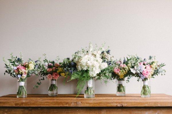 The stunning bridal and bridesmaids bouquets look amazing in any setting