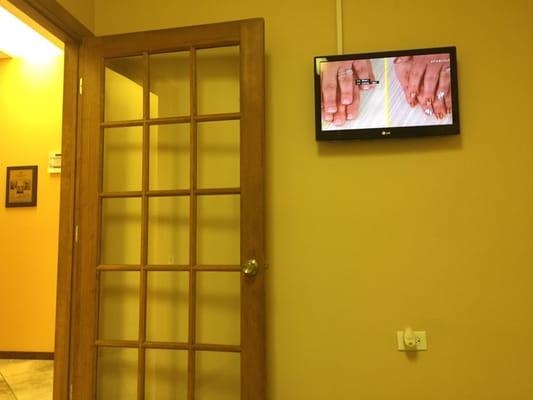 Watching tv while waiting for the doctor.