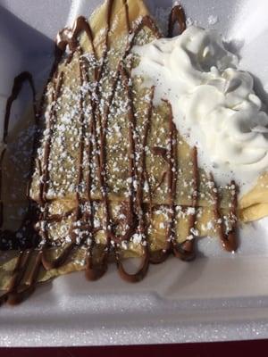 Nutella crepe with whip cream and powdered sugar