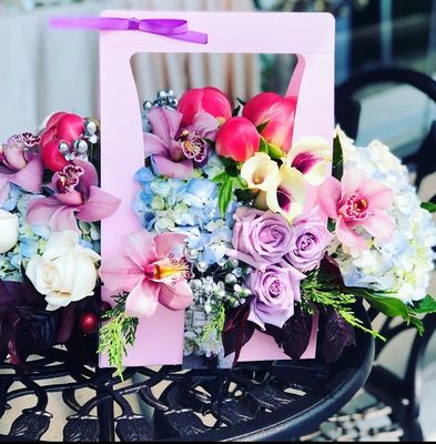 Basket of light colored flowers