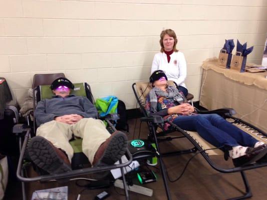 Spreading the Light at Body Mind Spirit Celebration. Floating the lights in "zero gravity" chairs.