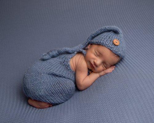 newborn boy in blue