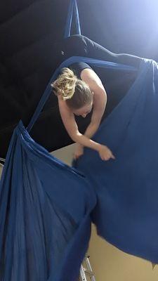 Aerial silks straddle back hang