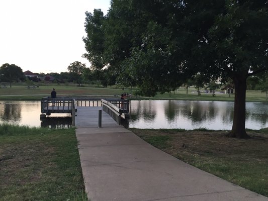 Small pier by a pond behind the Josey Branch Library