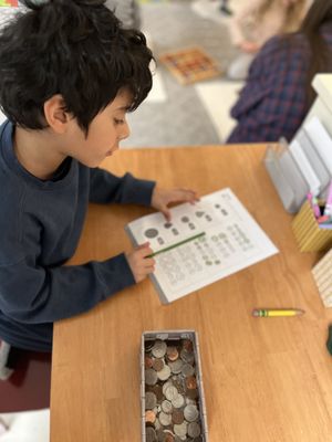 Our lower elementary classroom uses both Montessori math materials as well as Singapore Math.