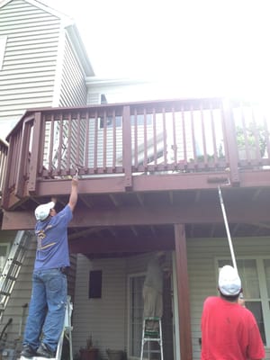 The guys working as team. Finishing my deck's staining.