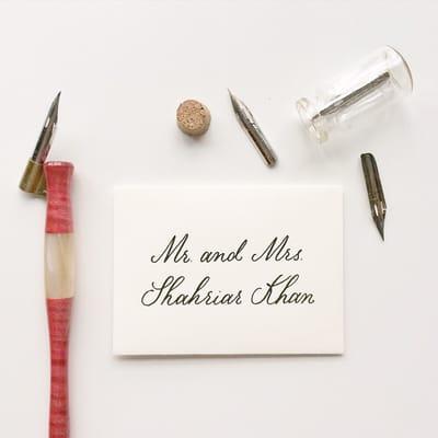 Simple black modern calligraphy on cotton white mini escort envelopes!