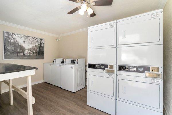 Newly renovated and improved laundry room. With new washers and gas-powered dryers.