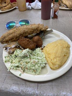 Fried mullet, cheese grits, coleslaw, and hush puppies. All fresh and made to order for only $6.99. UNREAL!