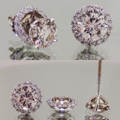 Stud earrings in "martini," three-prong setting, with removable diamond jacket. Two earrings in one!