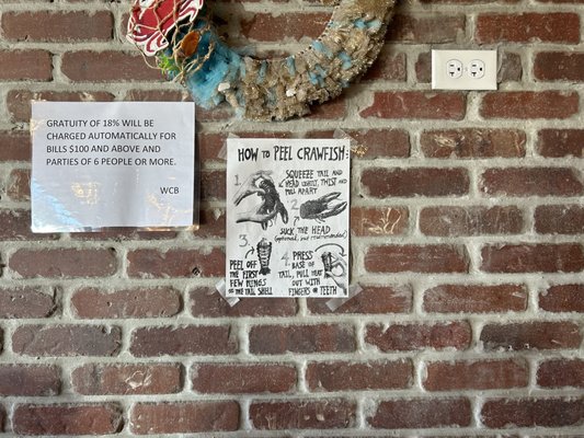 Poster on the wall with instructions for how to eat crawfish