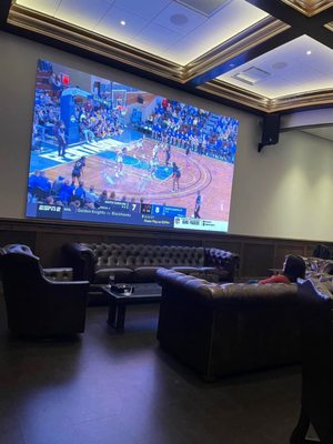 Large screen TV in Cigar Lounge