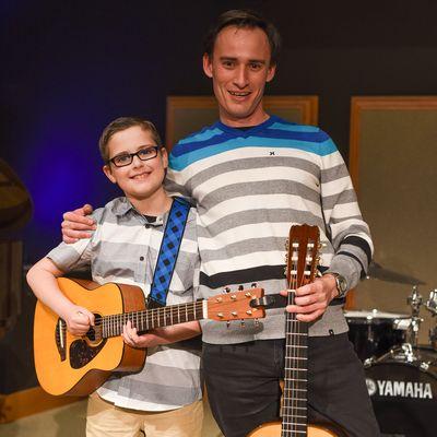 Guitar Teacher and Happy Student