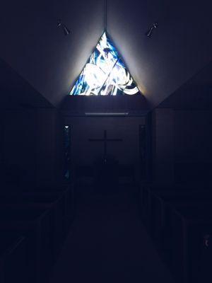 The gorgeous light from the stain glass. (It's much lighter in the worship/service. Just snapped a photo before the lights were on.)