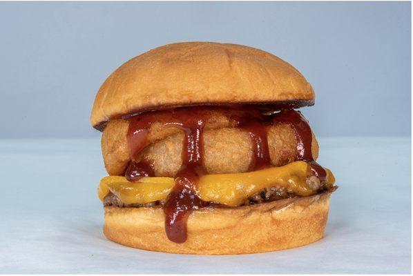 The Onion Burger - Impossible patty, cheddar cheese, onion rings, bbq sauce