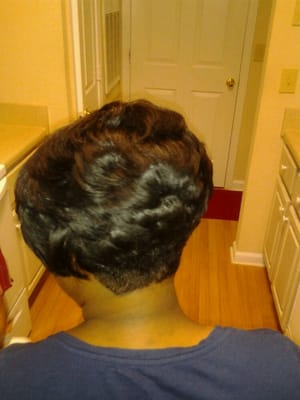 Stacked bob, tapered in back, layered and feathered all over