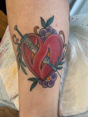 Heart w/ syringe tattoo commemorating my IVF experience. Done by the lovely Laura.