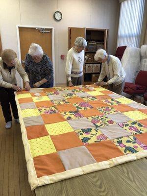 Sewing club making quilts