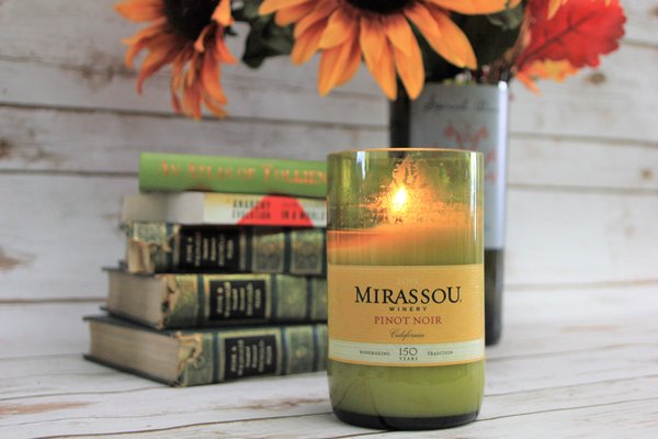 We make our candles out of wine bottles that we cut + polish and fill with scented soy wax