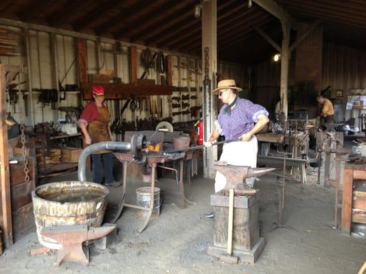 Fun blacksmith shop! These helpful employees answers lots of questions!