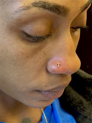 Nostril piercing by Kara