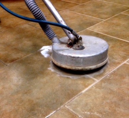 Carpet Maintenance performing tile grout cleaning services