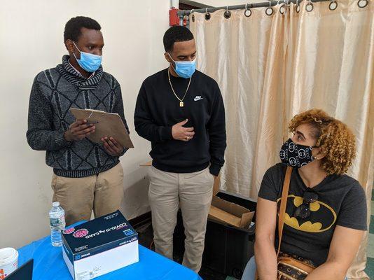 HSNHC COVID Vaccine staff provide Spanish translation to a vaccine patient.