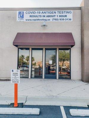 Park in one of the parking spaces designated with an orange cone. Text the phone number on the sign with your name and space number.