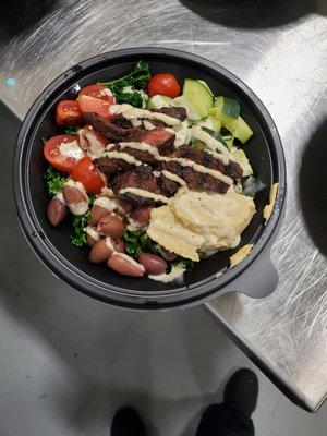 Mediterranean bowl with steak.