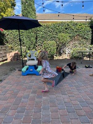 Kids enjoying the backyard. This company did our paver work!