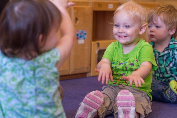 Child smiling in children's center.