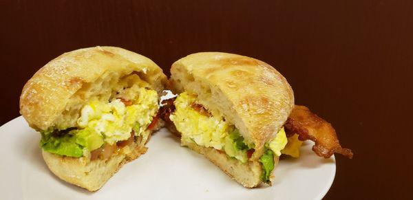 Egg A Nator on Ciabiatta Bread with Avocado, Tomato, Bacon and Cheese.