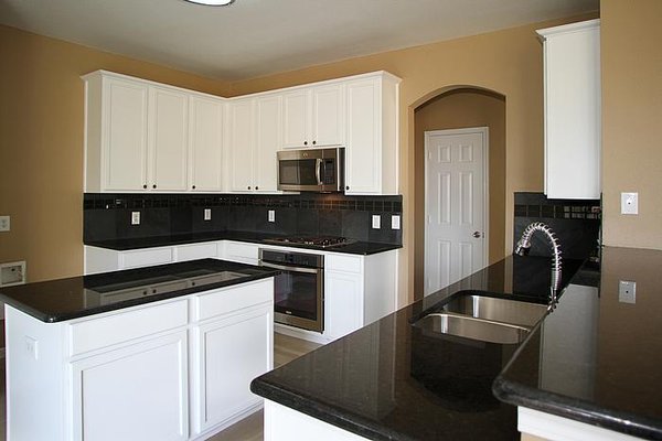 New clean look for old wood grain cabinets.