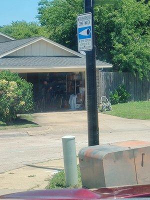 Inspector came out of house and is standing in garage behind the bush for several minutes when unexpectedly buyer comes out of the home.