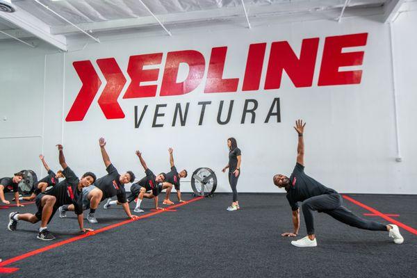 Coach Kevin leading All Sports Performance Training on the main floor of Redline Athletics Ventura