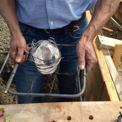 Placing crystals in the foundation of a factory I am working on in Oregon.