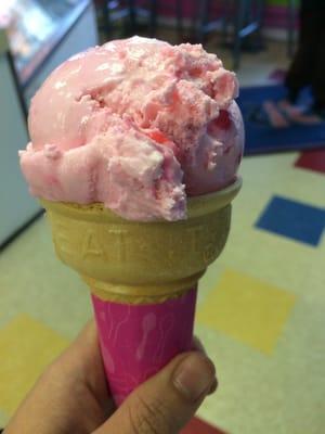 Bubble gum ice cream in a cake cone.