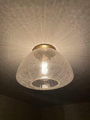 Crackled glass & gold base light fixture. Beautiful light reflection onto ceiling from this elegant light that's simply gorgeous!