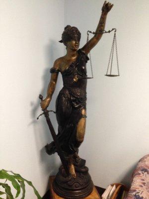 This 7-foot-tall solid bronze statue of "Lady of Justice" adorns the lobby of STREET LAW FIRM.